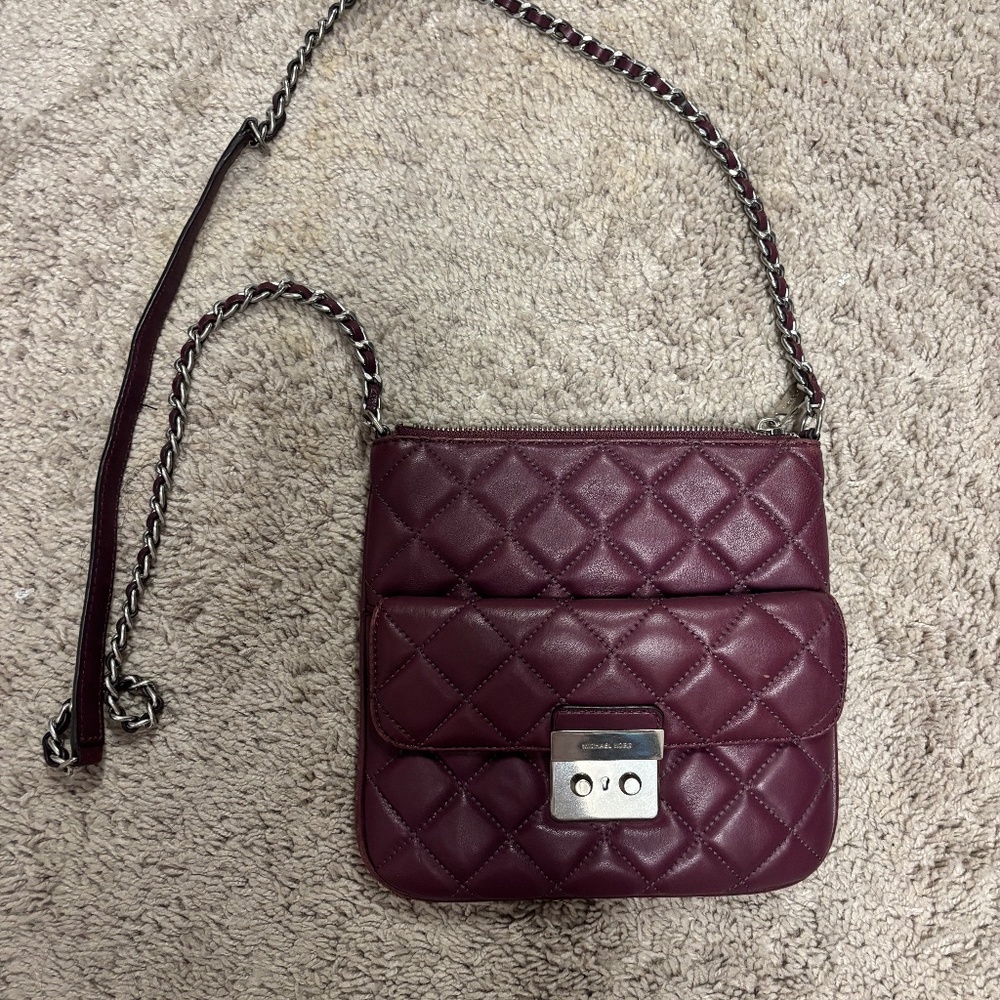 Burgundy Micheal Kors crossbody with lots of pockets